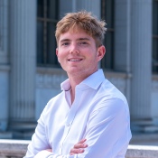 A headshot photo of Oliver Maynard